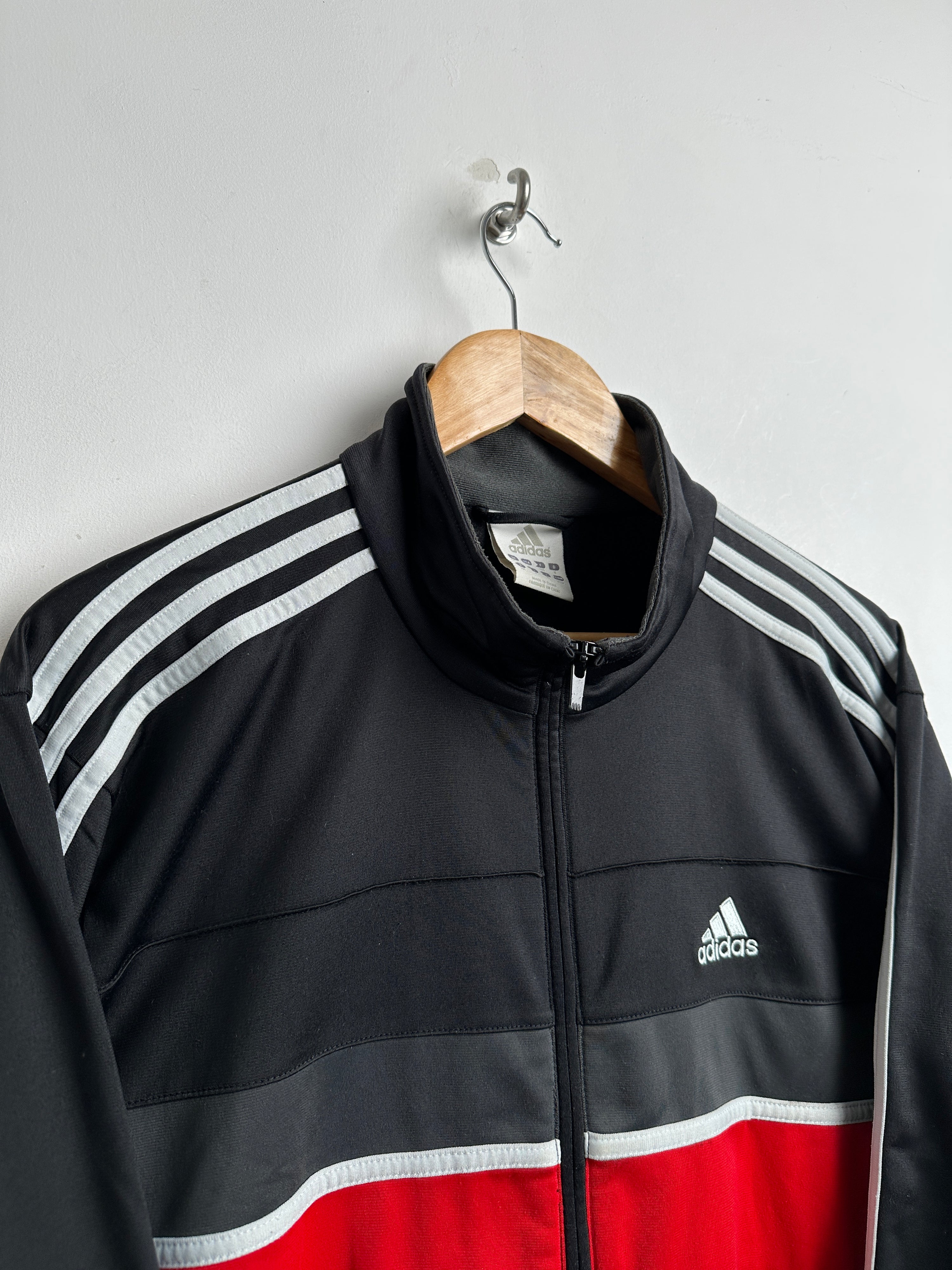 ADIDAS zip-up in black with red line