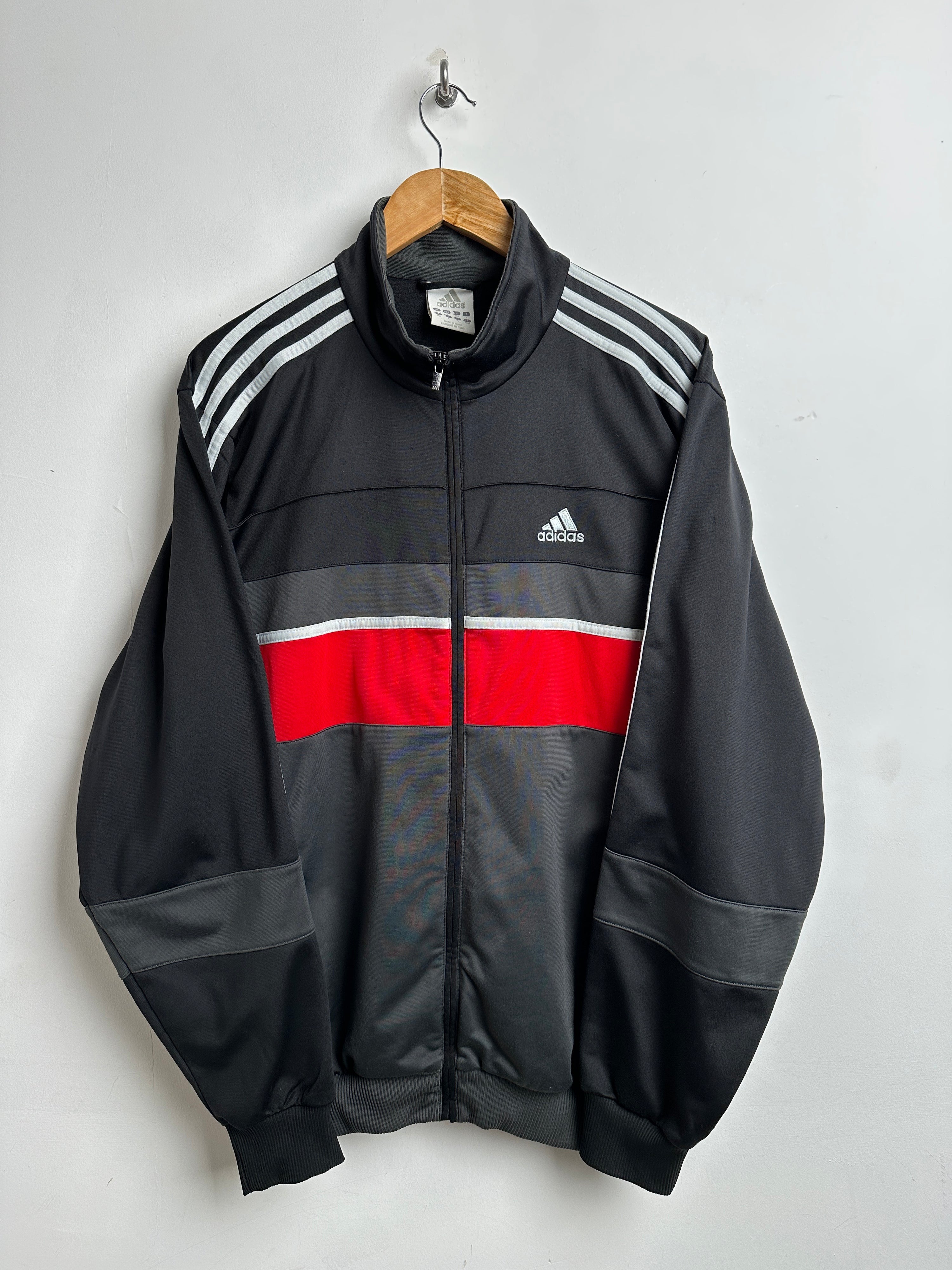 ADIDAS zip-up in black with red line